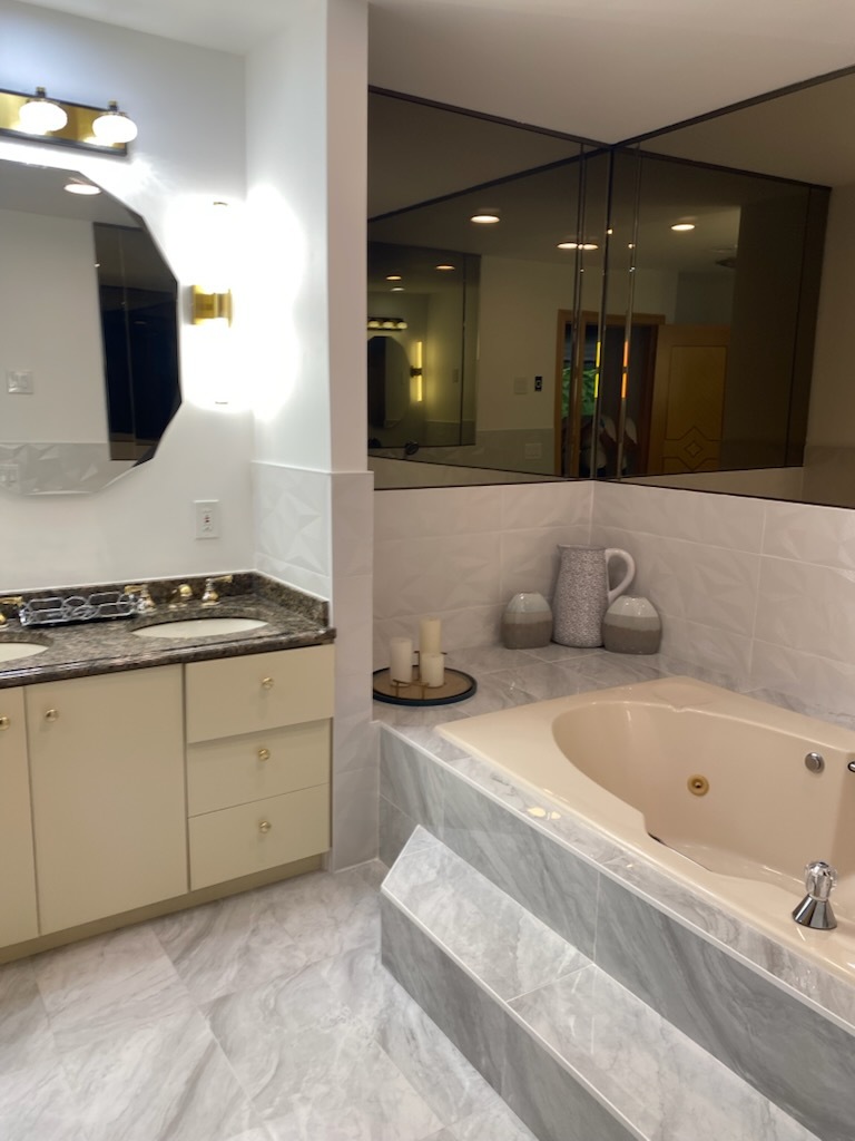 Master bathroom with jetted tub and mirrored vanity in Irvington NJ
