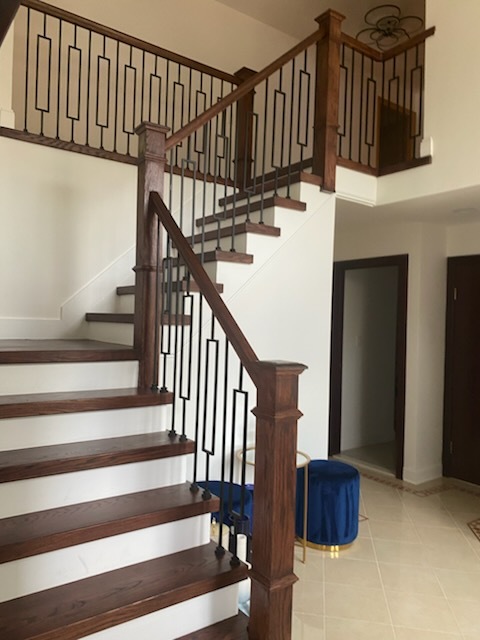 Freshly cleaned wooden staircase and railing in Newark NJ