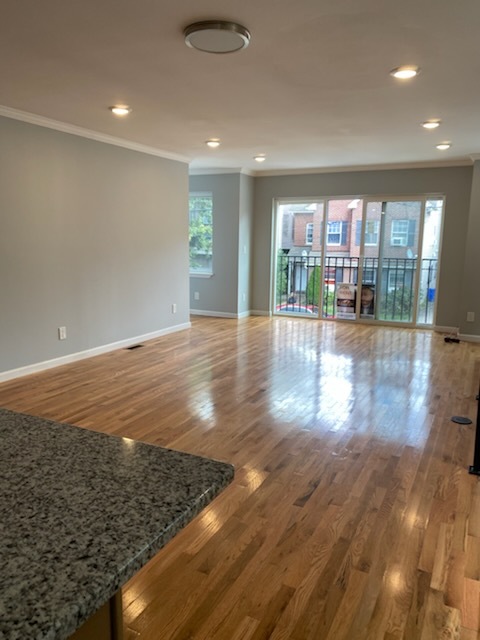 Open-plan living room and kitchen freshly cleaned in South Orange NJ